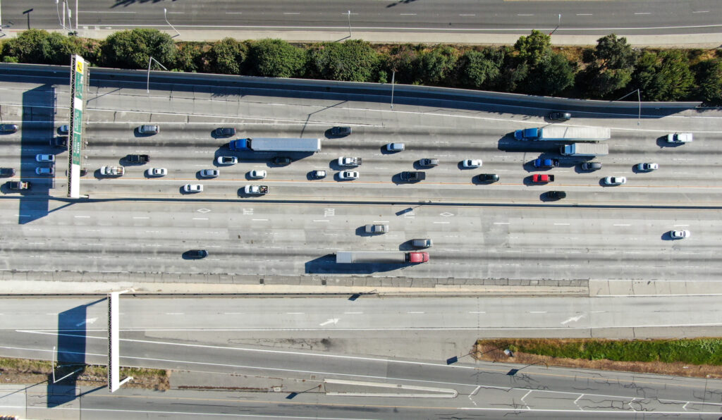 Aerial top view of highway with traffic in Los Angeles, California, USA